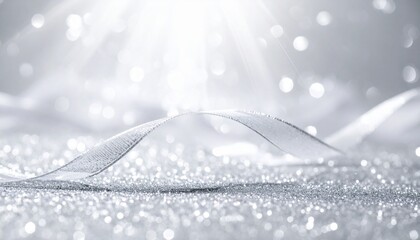 Sparkling ribbon on glittery surface with dreamy bokeh and light beams.