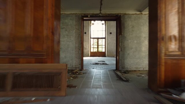 Main hall of Tskaltubo spa with empty chairs, peeling paint, and high ceilings in warm light