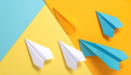 Four Paper Airplanes in Blue Yellow Orange White Colors on a Geometric Background