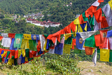 Far view of Chokhor Raptentse Dzong in Trongsa with tibetan flags