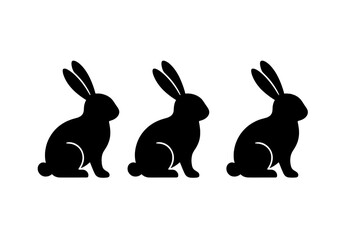 Three black rabbits sitting in a row, showcasing simple silhouette design suitable for various artistic applications
