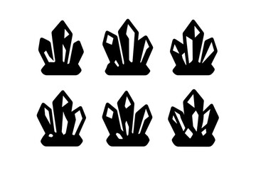 Various crystal shapes in black silhouette displayed on a plain background