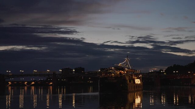 View of Garonne dock and boat at night, Toulouse France