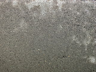 Gray and porous concrete surface.
