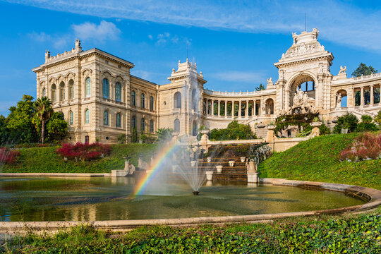 Raindow above the sprinkling water fountain in the public gardens in front of Longchamp Palace in Marseille, Provence, France