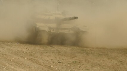 heavy tank attacks in clouds of dust