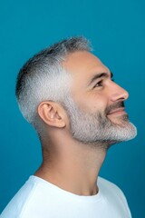 Obraz premium A serene and handsome man posing in style. A joyful man with a t