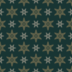 Vector seamless pattern with old-fashioned Christmas snowflake stars. Elegant geometric holiday texture with decorative ornamental crystals. Winter festive background. Gold and green design