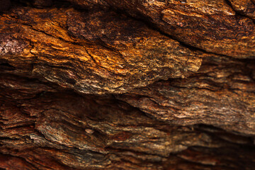 Abstract close view of cracked layered rock surface. High quality photo