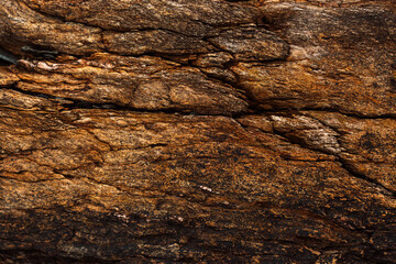 Natural rock strata forming rough textured stone background. High quality photo