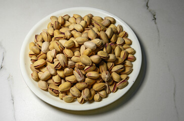 A bowl full of roasted pistachios