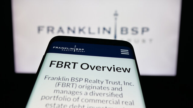 Stuttgart, Germany - 10-30-2025: Mobile phone with website of US company Franklin BSP Realty Trust Inc. on screen in front of logo. Focus on top-left of phone display.