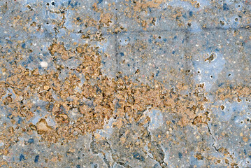Sand and grit spread on icy paving slabs providing better traction and preventing accidents during winter weather conditions. Winter maintenance, grit and reagents on pavement improving traction