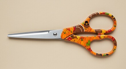 Colorful Scissors with Orange Patterned Handles on a Neutral Background.
