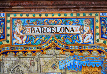 Colourful ceramic tiles depicting the city of Barcelona at Plaza de Espa&ntilde;a in Seville, Spain