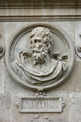 tone relief depicting a classical figure on the faade of Seville City Hall. The medallion includes the Latin inscription S.P.Q.HIS Senatus Populusque Hispalensis, the Senate and People of Seville