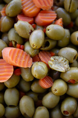 close up of a pile of fresh organic vegetables and olives
