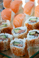 close up of sushi with salmon and wasabi