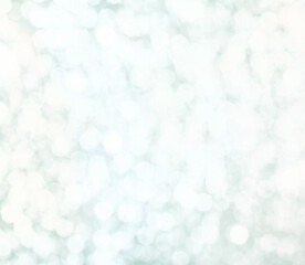 Colorful twinkling lights on bright abstract cold blue background. Intentionally hazy out of focus bokeh effect.