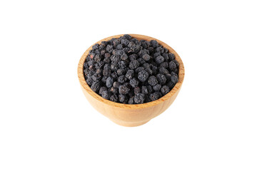 Dried Aronia or black chokeberry - Aronia melanocarpa in latin in wooden bowl isolated on white background.