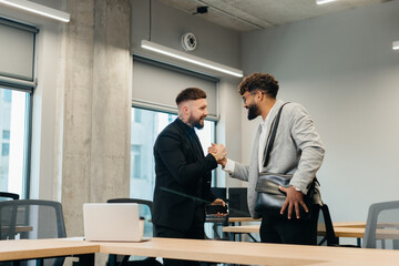 Business partners shaking hands finalizing agreement