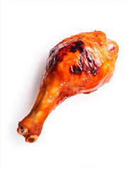 Roasted chicken leg with crispy golden brown skin isolated on a white background