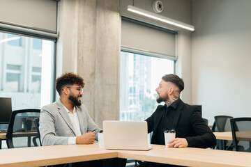 Business professionals discussing ideas in modern office