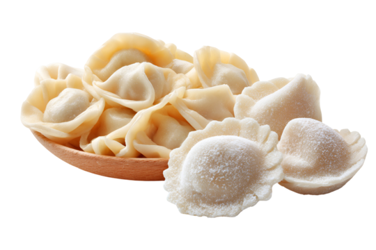 Close up of uncooked fresh tortellini pasta in a bowl against a black background