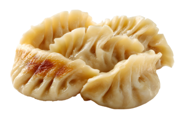 Steamed dumplings with pleated tops on a dark background