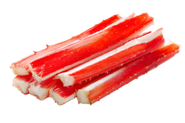 Freshly prepared imitation crab sticks stacked on a dark background