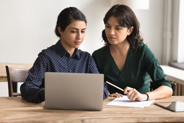 Young businesswoman legal advisor consult female client using notebook screen