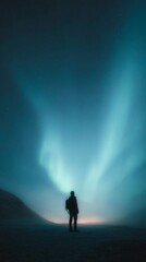 Solitary Traveler Silhouette with Backpack Under Vertical Aurora Borealis Sky