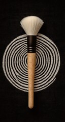 Elegant Makeup Brush on Circular Pattern Background.