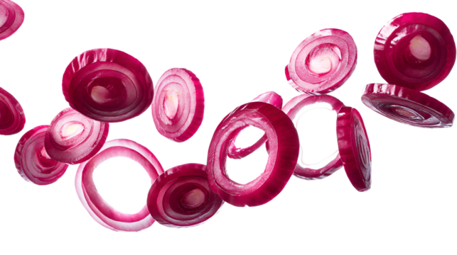 Abstract composition of vibrant red onion rings suspended in mid air against a dark background