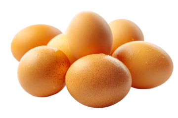 A cluster of fresh brown chicken eggs isolated on a deep black background