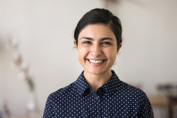 Headshot portrait friendly beautiful young woman with bright confident smile