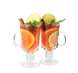 Tasty punch drink in glasses isolated on white. Christmas season
