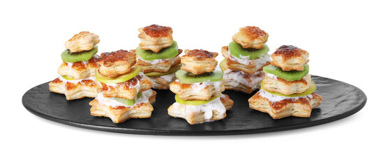 Sweet snacks made of puff pastry and slices of kiwi isolated on white. Christmas food