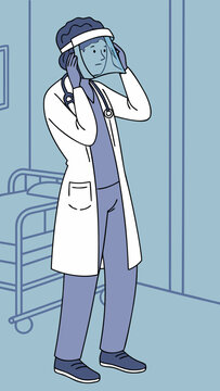 Doctor adjusting face shield while preparing in hospital setting  
