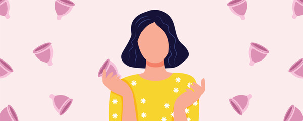 Caucasian woman holding menstrual cups on pink background. Menstruation, gynecology, and women’s health concept
