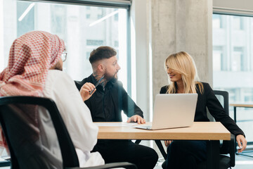 Diverse business professionals discussing strategy during meeting