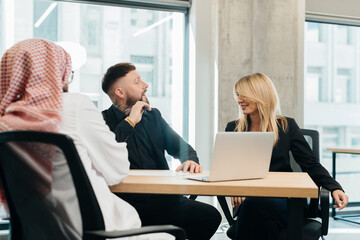 Diverse business professionals discussing strategy during office meeting