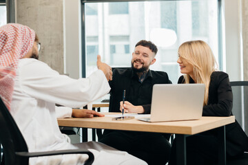 Middle eastern man meeting business partners in modern office