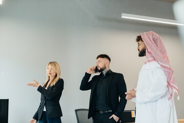 Diverse business team discussing strategy in modern office