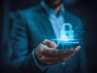 Businessman holding smartphone with digital hologram lock symbolizing advanced mobile data security and cybersecurity protection in technology concept