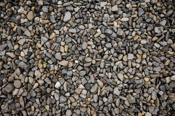 Natural stones background with mixed textures and colors.