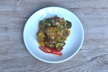 spicy fried pork bone and flat bean with curry on plate