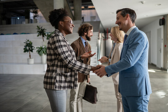 Business people shaking hands celebrating agreement