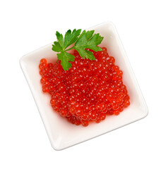 Red caviar in a white square ceramic bowl decorated with a sprig of parsley