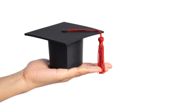 Close-up view of a hand holding a graduation cap with a red tassel
